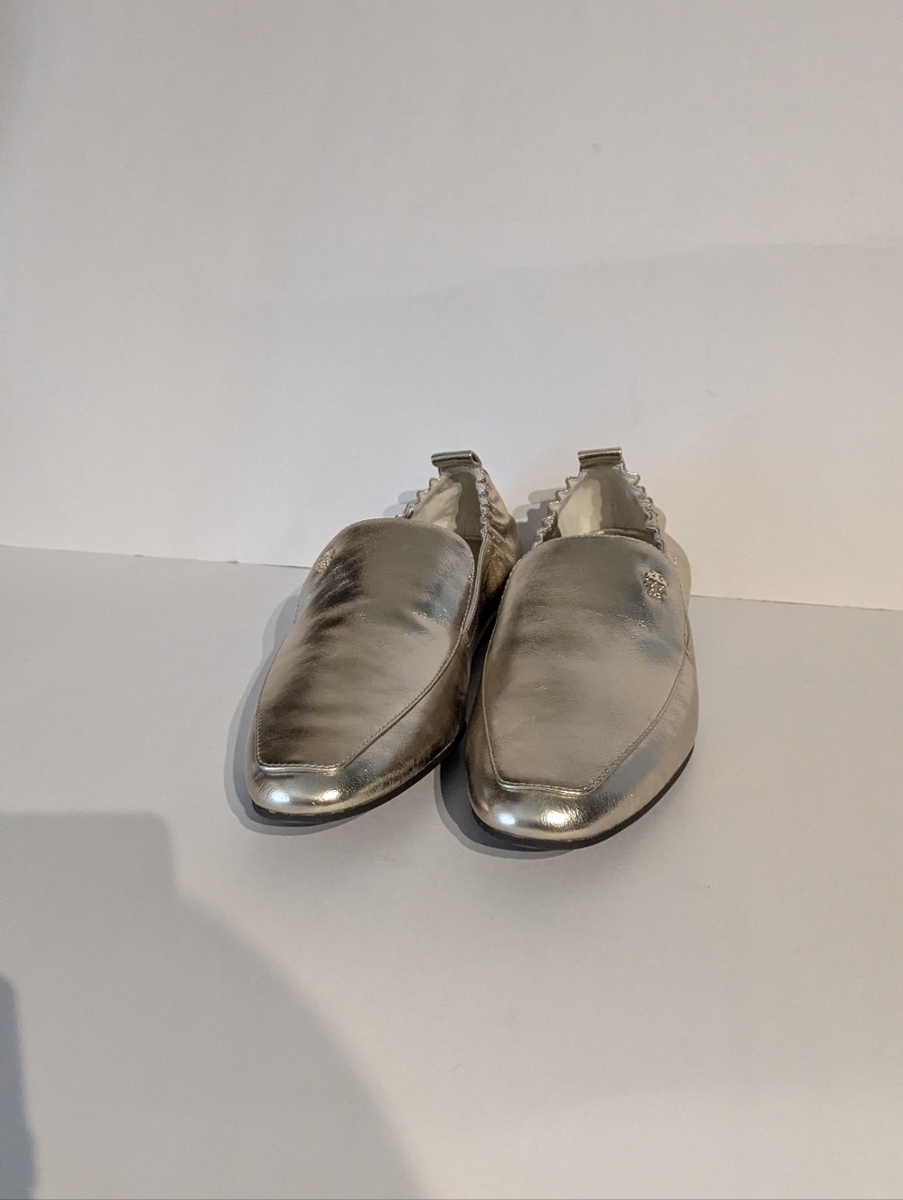 The TORY BURCH Tibi Metallic Silver Slip-On Loafers
